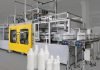 Blow moulding machines for producing milk containers