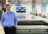 Arun Pandey, vice president Afflatus in front of the DuPont 3000 modular automated processing line for flexo plates Photo PSA