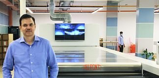 Arun Pandey, vice president Afflatus in front of the DuPont 3000 modular automated processing line for flexo plates Photo PSA
