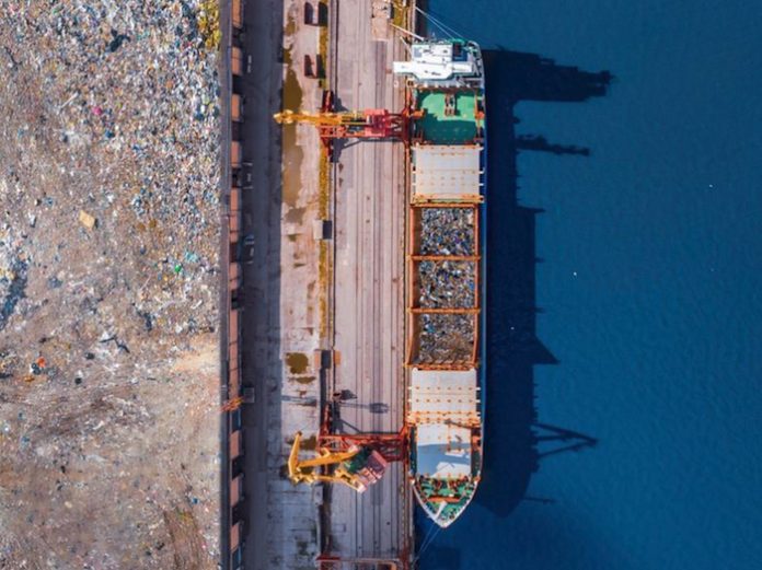 Plastic scrap is transferred by ship to be recycled. Photo Packaging Europe
